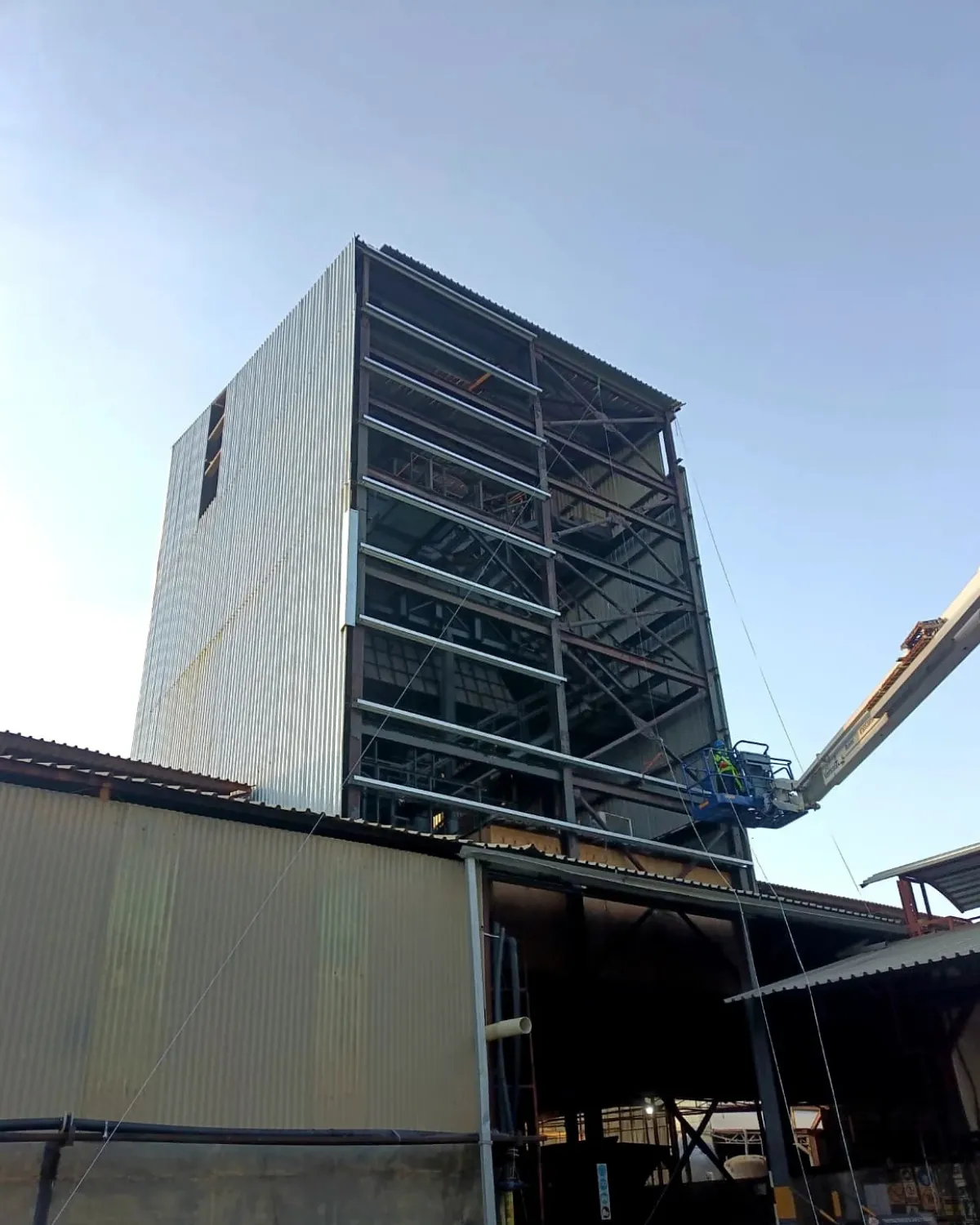 Industrial tower refurbishment in progress with structural framing exposed