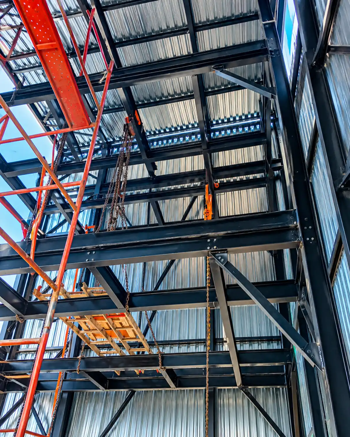 Interior steel framework and structural refurbishment work inside an industrial tower